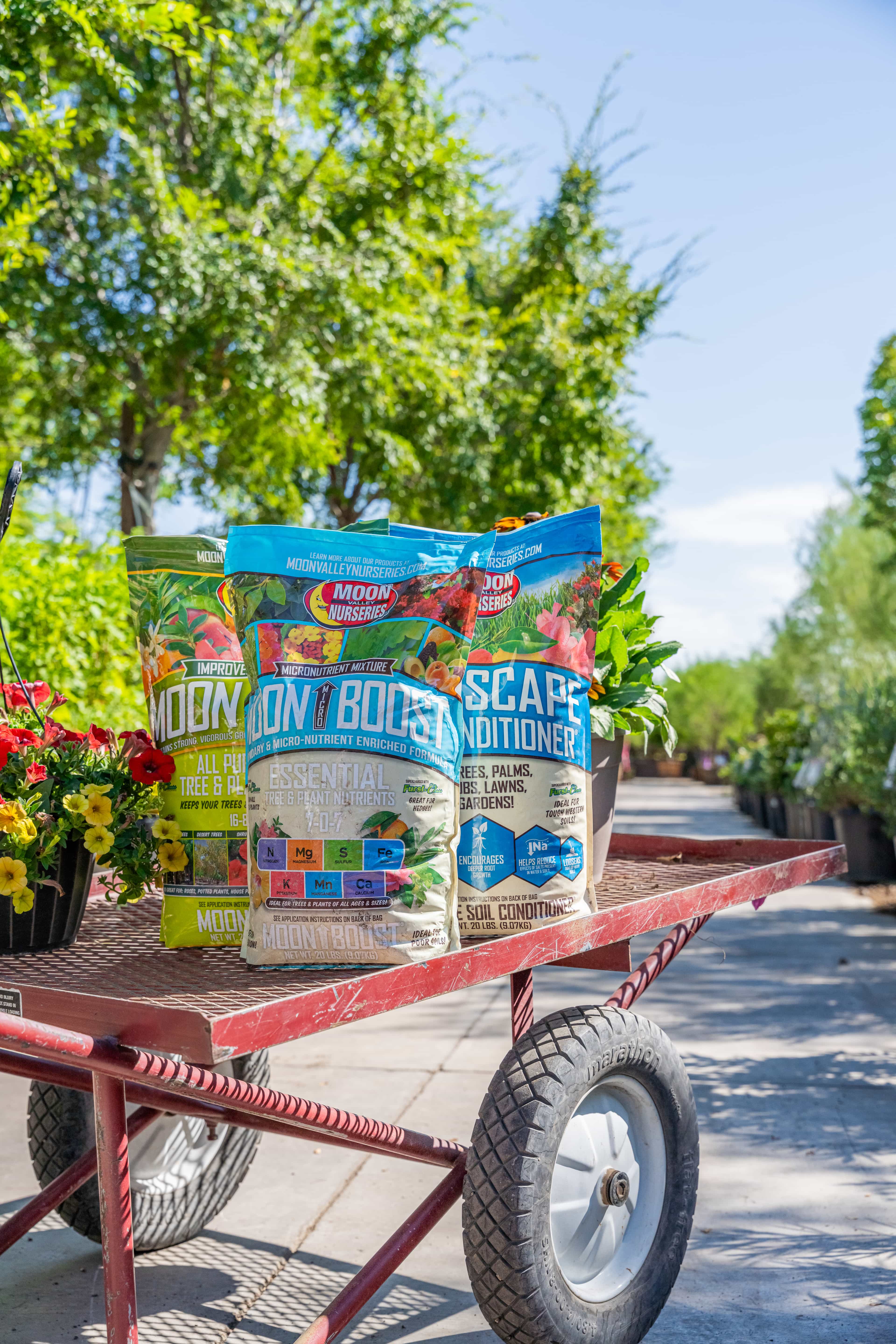 Photo of a cart in the nursery with our granular on it.